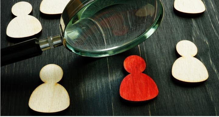 Magnifying Glass and Wooden Figures