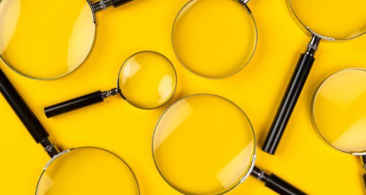 Magnifying glasses on the yellow background