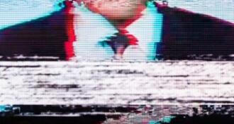 Man in a suit on the screen