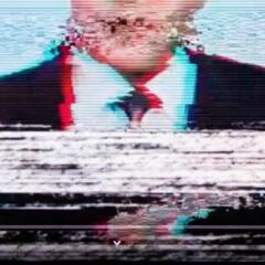 Man in a suit on the screen