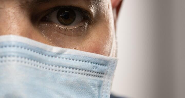 Close up of man wearing a mask