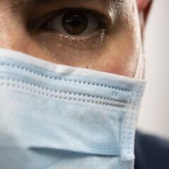 Close up of man wearing a mask