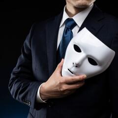 Man in suit and mask