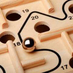 Plastic maze game with metal ball