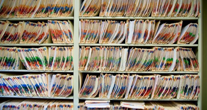 Shelves full of medical records and patient charts 