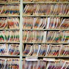 Shelves full of medical records and patient charts 