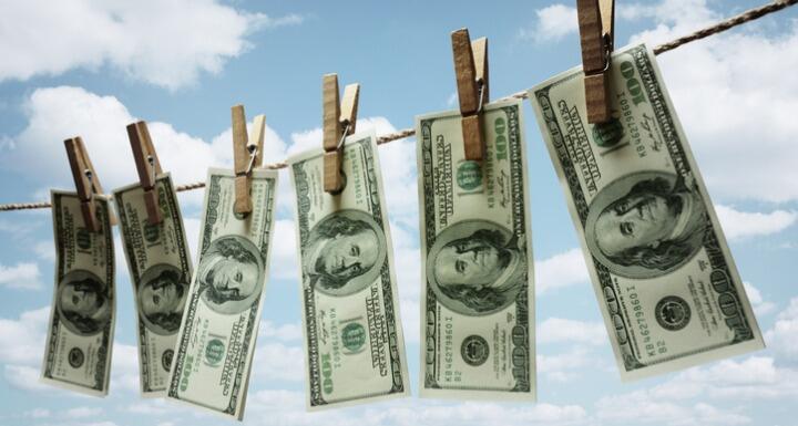 Money hanging outside on laundry wire