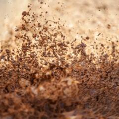 Body of muddy brown water caught mid-splash