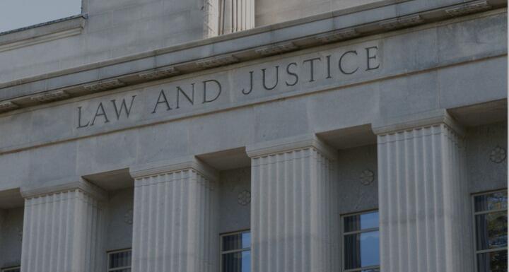 Close up shot on the words Law and Justice on NC Courthouse