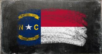 North Carolina flag drawn in chalk on chalkboard