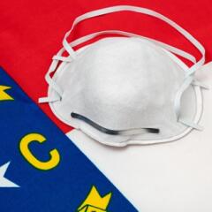 Mask setting on top of North Carolina Flag 