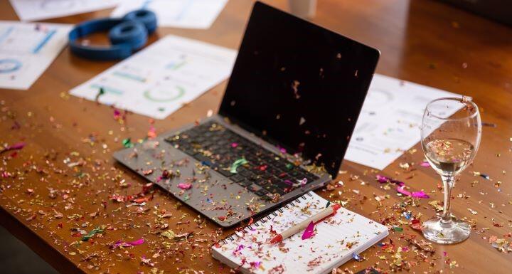 Office party with confetti on laptop 