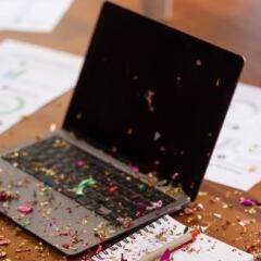 Office party with confetti on laptop 