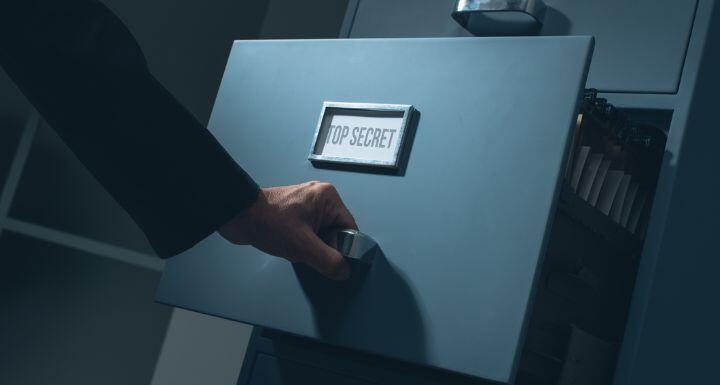 Office worker searching confidential information