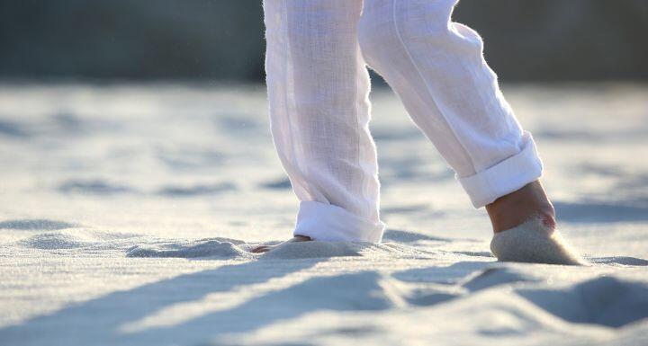 Person in white pants at beach