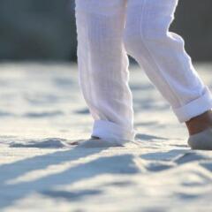 Person in white pants at the beach