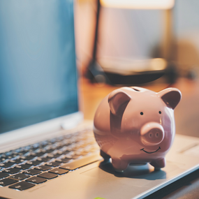 Piggy bank on laptop