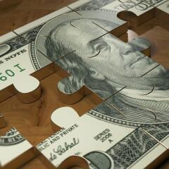 Hundred dollar bill puzzle with missing pieces