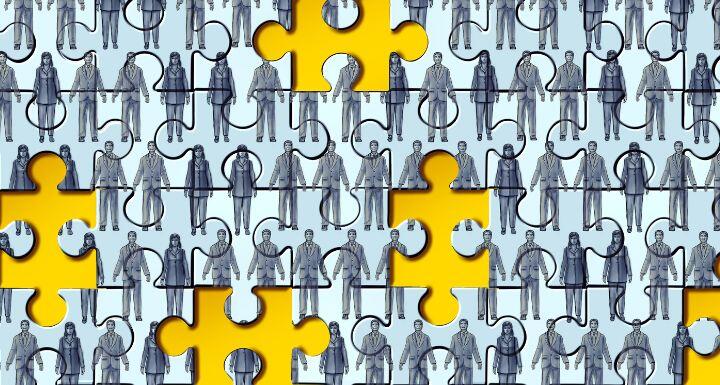 Puzzle pieces with workers on the piece