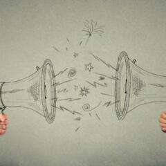 Quarrel between two men screaming at each other in megaphone