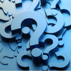 Blue cut outs of question marks arranged in an artful pile