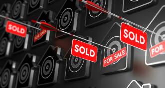 Multiple home icons on board with several having arrow sold signs