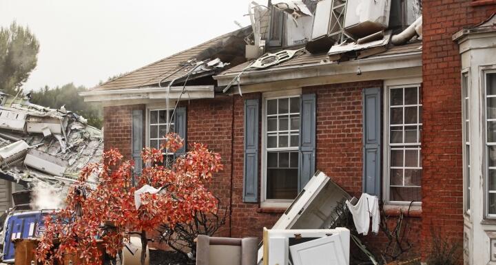 Red brick house damaged by a natural disaster