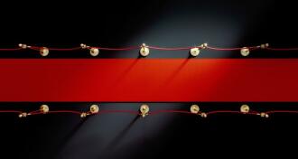 Red carpet over black background.