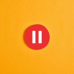 Red round circle with a pause button 