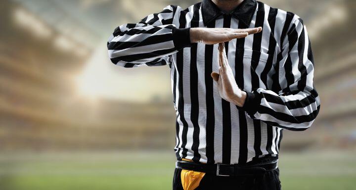 Referee doing time out gesture