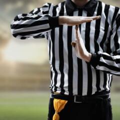 Referee doing time out gesture