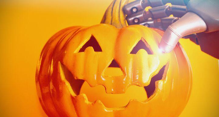 Robotic arm holding halloween jack-o-lantern
