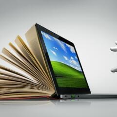 Robotic hand typing on a laptop