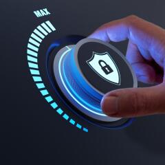 A hand moving dial with a shield icon on it. 