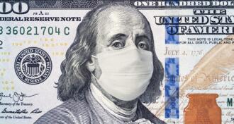 Illustration of a hundred dollar bill with Ben Franklin wearing a medical mask in response to COVID-19