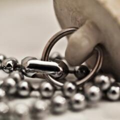 Sink plug attached to a chain