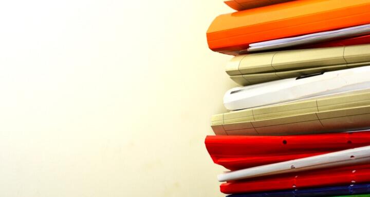 Stack of file folders on a desk