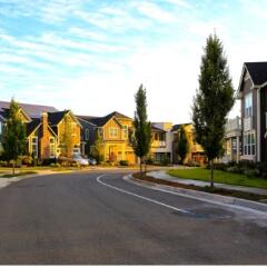 Neighborhood of homes with sun shining on the homes