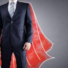 Superhero businessman with red cape 
