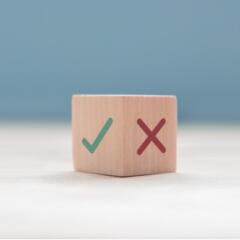 checkmark and x on wooden block