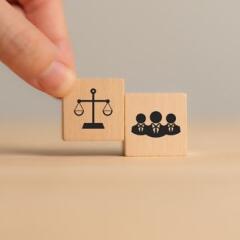 Two blocks with a gavel and group icons