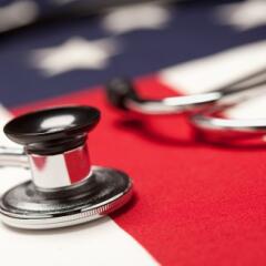 Stethoscope lying on top of American flag