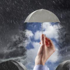 Umbrella over clear skies