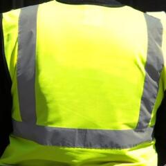 Unrecognisable yellow vest person