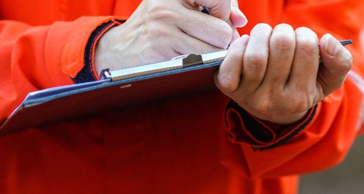Writing on the safety checklist in audit