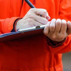 Writing on the safety checklist in audit