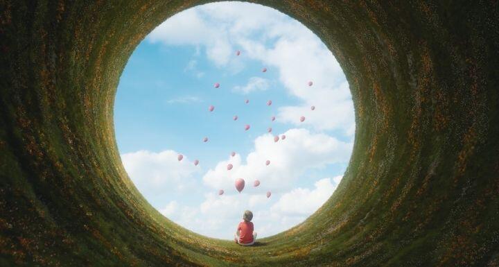 Young boy sitting in fantasy landscape 