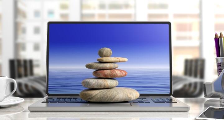 Zen stones stack on a computer
