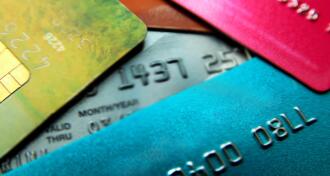 a colorful collection of credit cards in a pile
