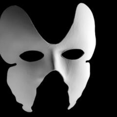 A white party facemask on a black background